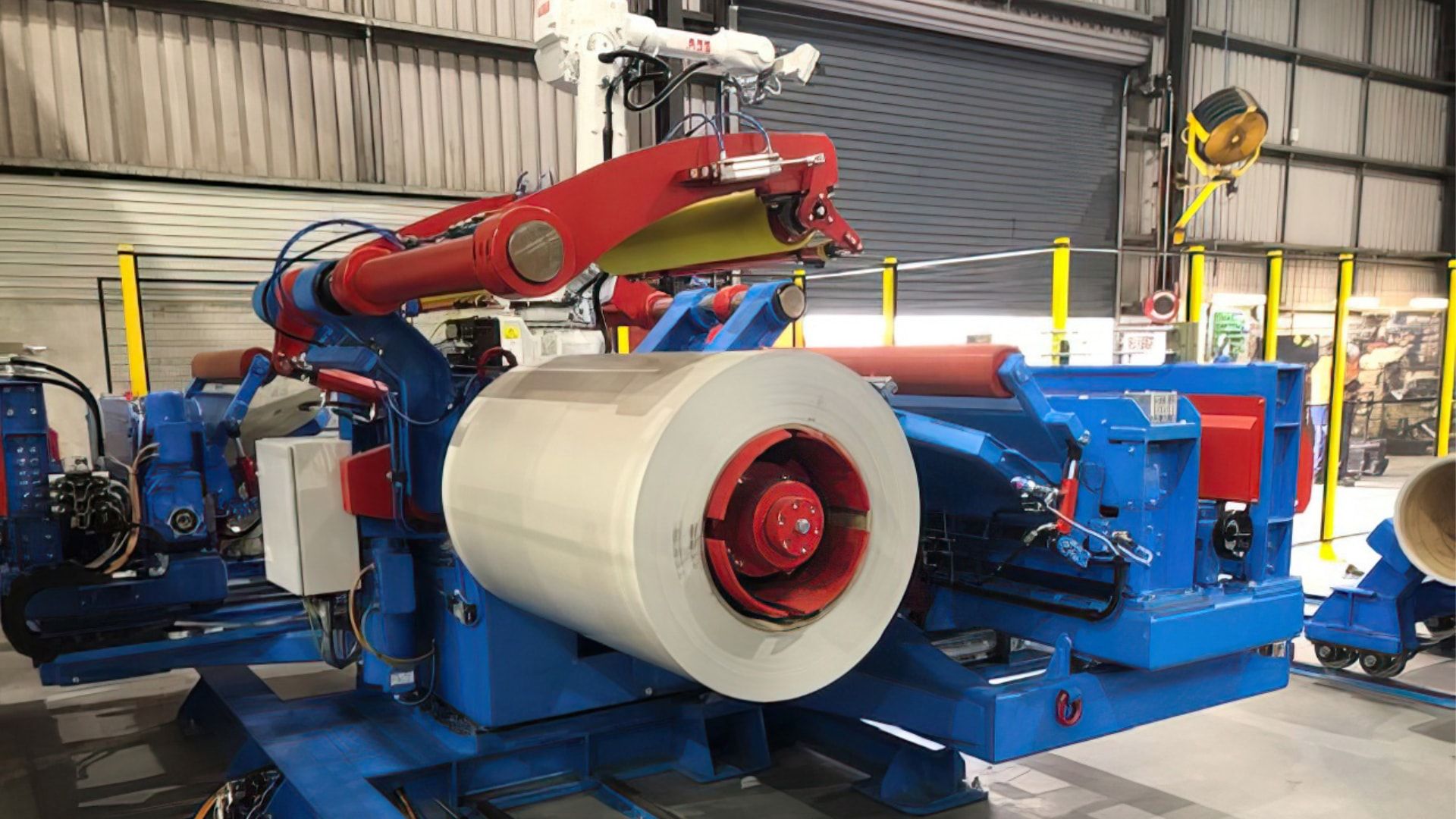 Coilswift robotic twin-head uncoiler with a painted steel coil loaded