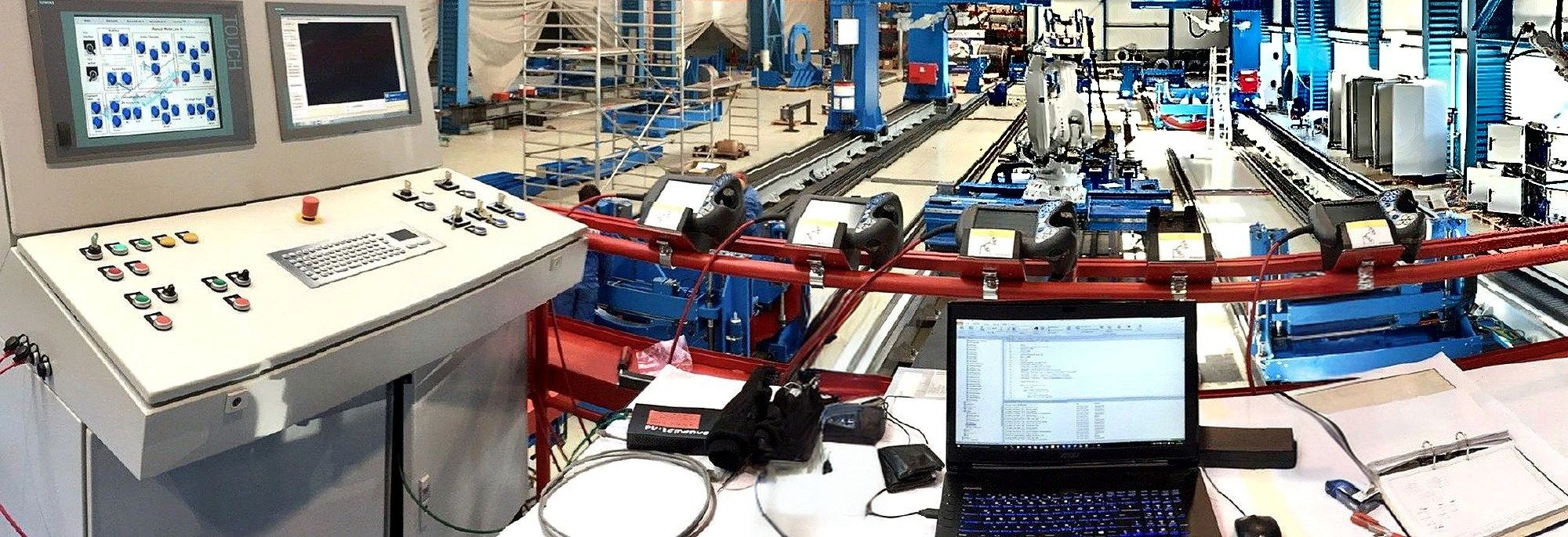 Control console overlooking an automated production line in a factory hall