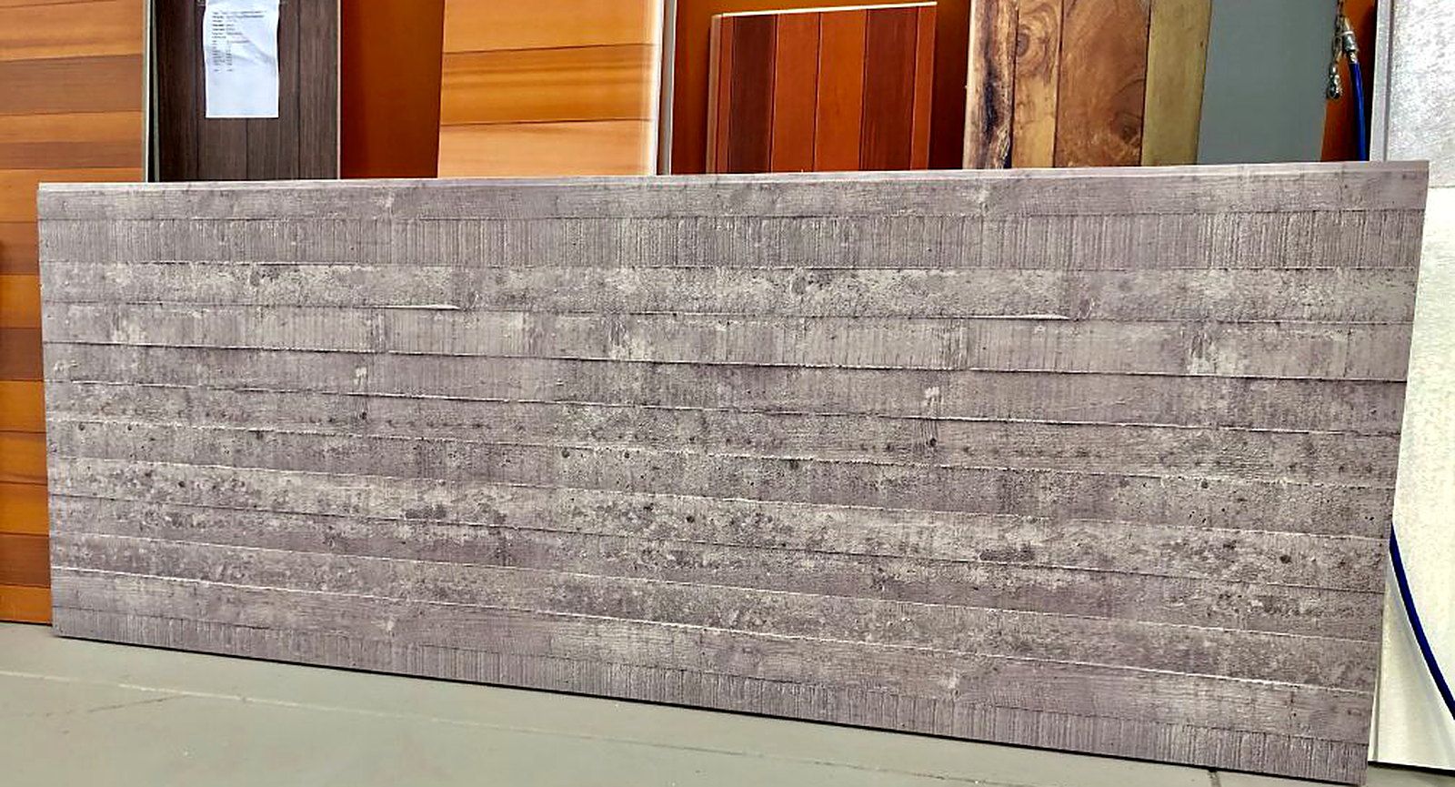 Insulated metal panel printed with a weathered stone-block pattern