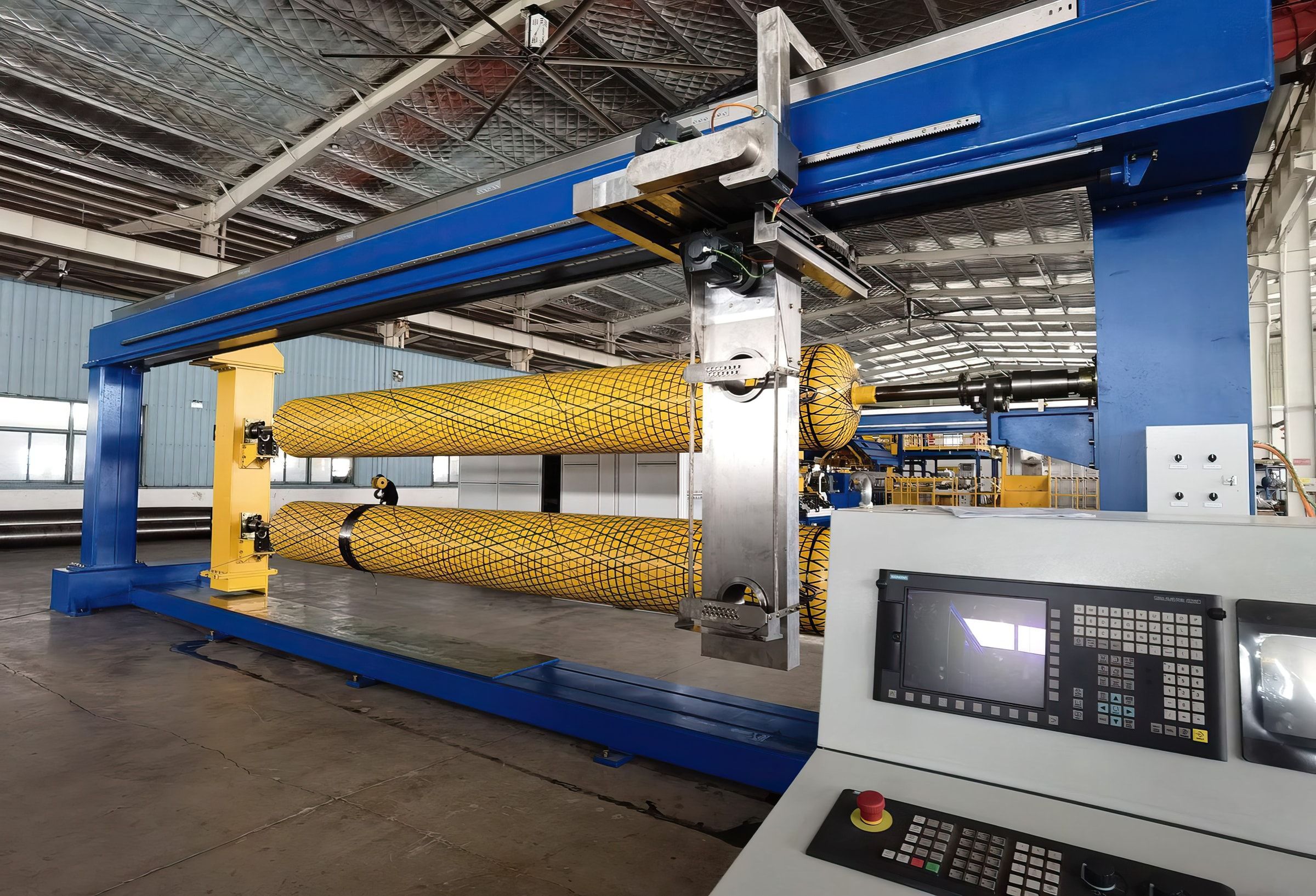 Servo roll-forming line with blue tooling rafts and operator control console